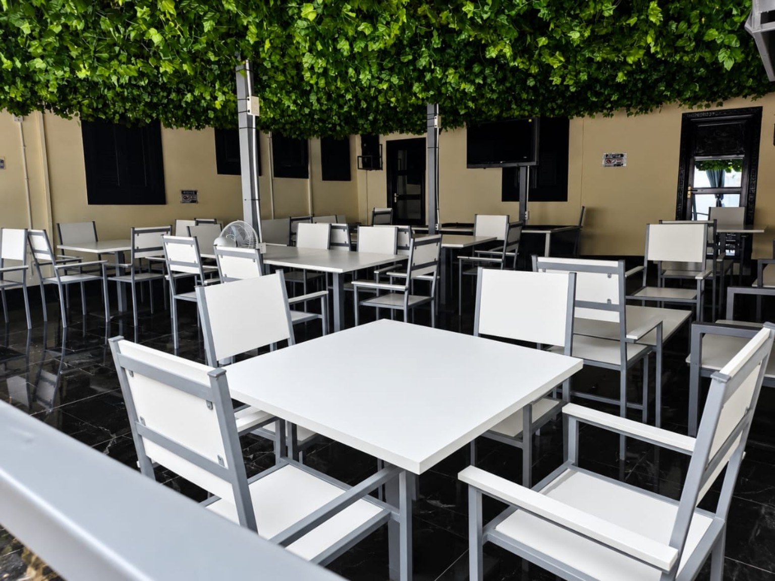 Outdoor bar seating area at Lloyd Hotel